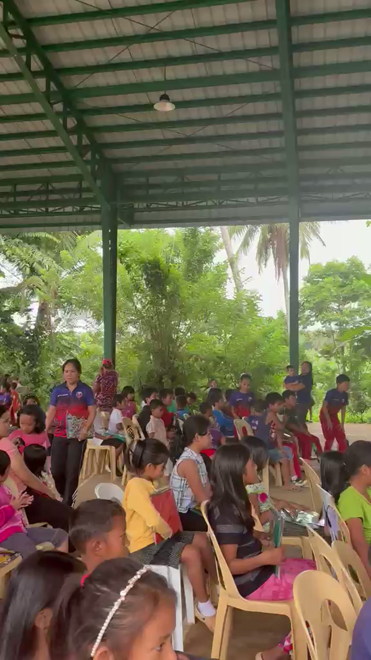 Children in Bansalan receiving Iva and Shiv Foundation school supplies